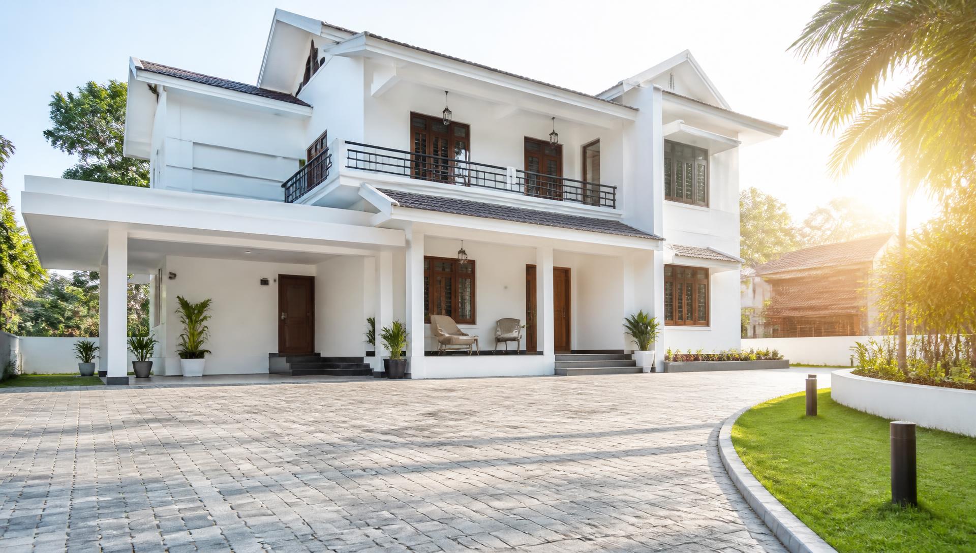 Modern house with an interlocking concrete paver block driveway laid by AMS Pavers in Trichy